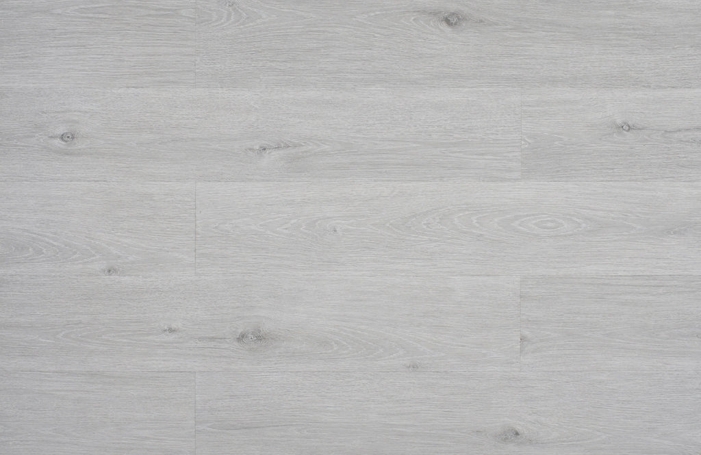 
Top-down flat lay of Grey Oak SPC planks showing pale silver-grey oak grain with subtle knot detail across full plank layout