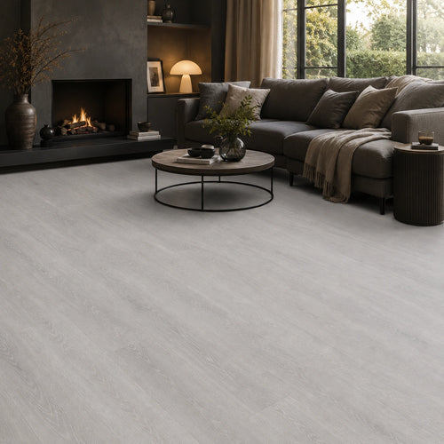Grey oak SPC LVT flooring in a dark, contemporary living room with black fireplace surround