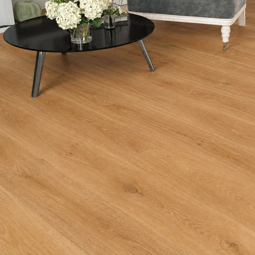 Maple oak SPC flooring shown in close-up at an angle, highlighting the natural wood grain texture