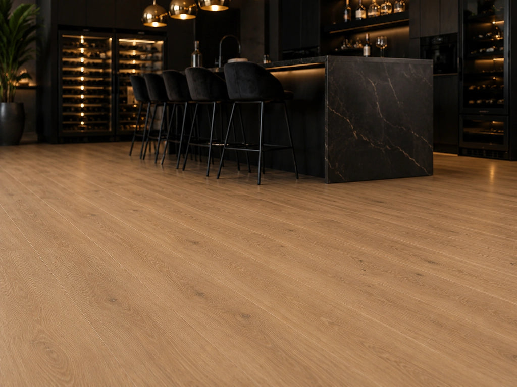 Maple Oak SPC flooring in a luxury bar and kitchen setting with black marble island, velvet bar stools and illuminated wine storage