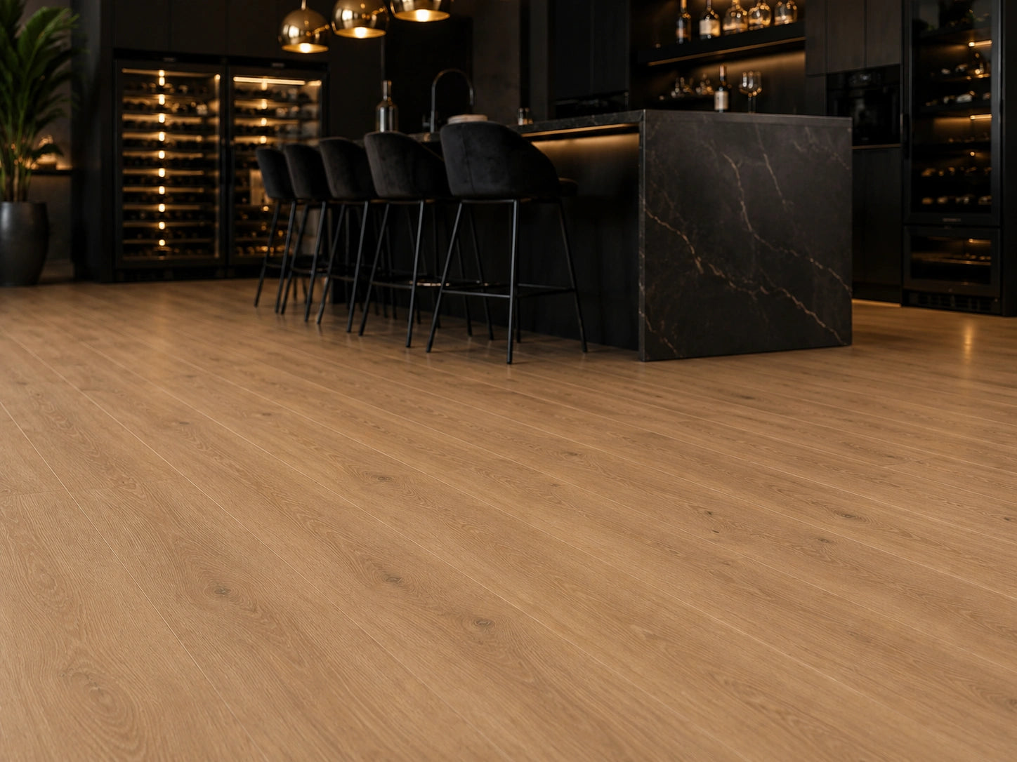 Maple Oak SPC flooring in a luxury bar and kitchen setting with black marble island, velvet bar stools and illuminated wine storage