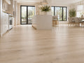 Natural Pine Oak SPC flooring in a large open-plan kitchen and dining room with white marble island, black-framed doors and natural light