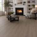 Seasoned oak SPC LVT flooring in a classic living room with white fireplace and built-in shelving